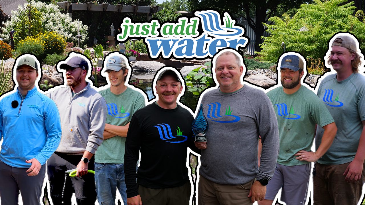 The Just Add Water crew standing together under the company logo