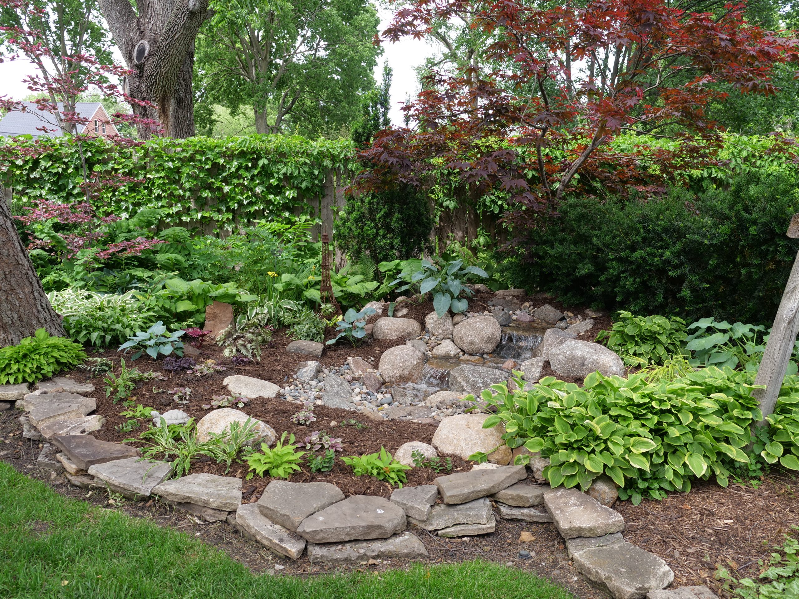 Finished water feature from the Pondless Waterfall, Des Moines project by Just Add Water